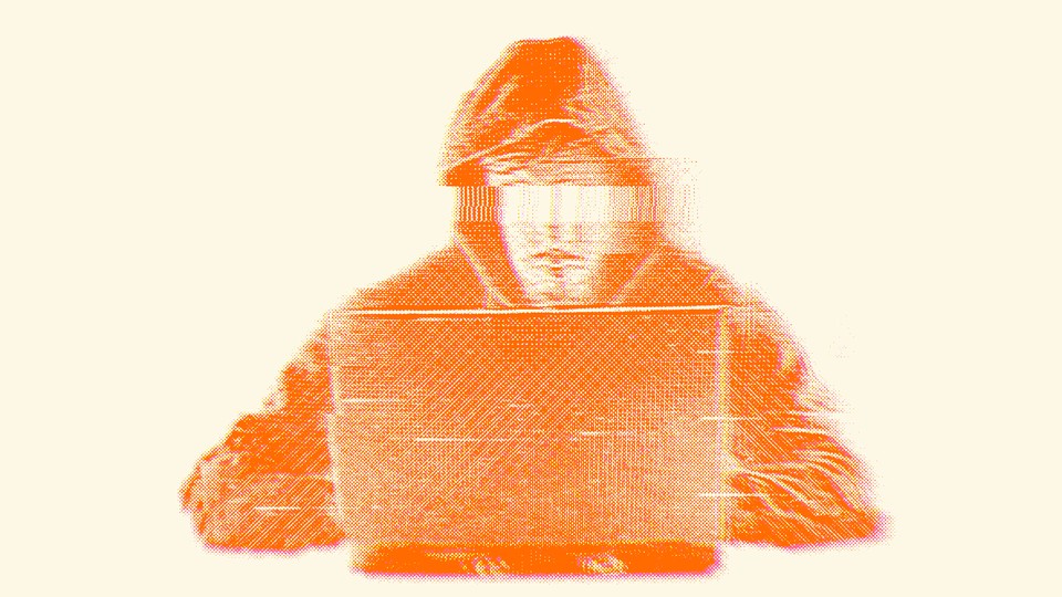 An orange-scale illustration of a hooded person with eyes blurred out, typing into a laptop.