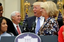 Vice President Mike Pence, President Donald Trump, and Education Secretary Betsy DeVos are seen laughing at a school-choice event in Washington, D.C.