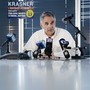 Larry Krasner, the Democratic candidate for district attorney in Philadelphia, sits at a table and speaks into multiple microphones during a news conference in May.