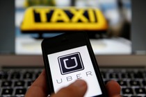 A cell-phone user uses the Uber app