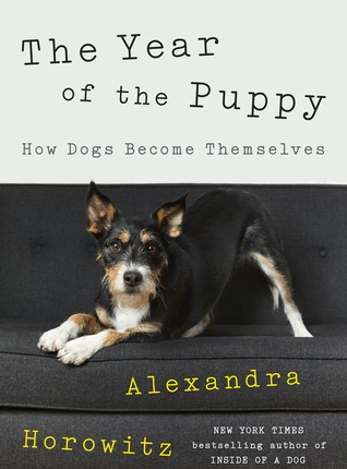 book cover with "The Year of the Puppy: how Dogs Become Themselves" and dog stretching on a couch