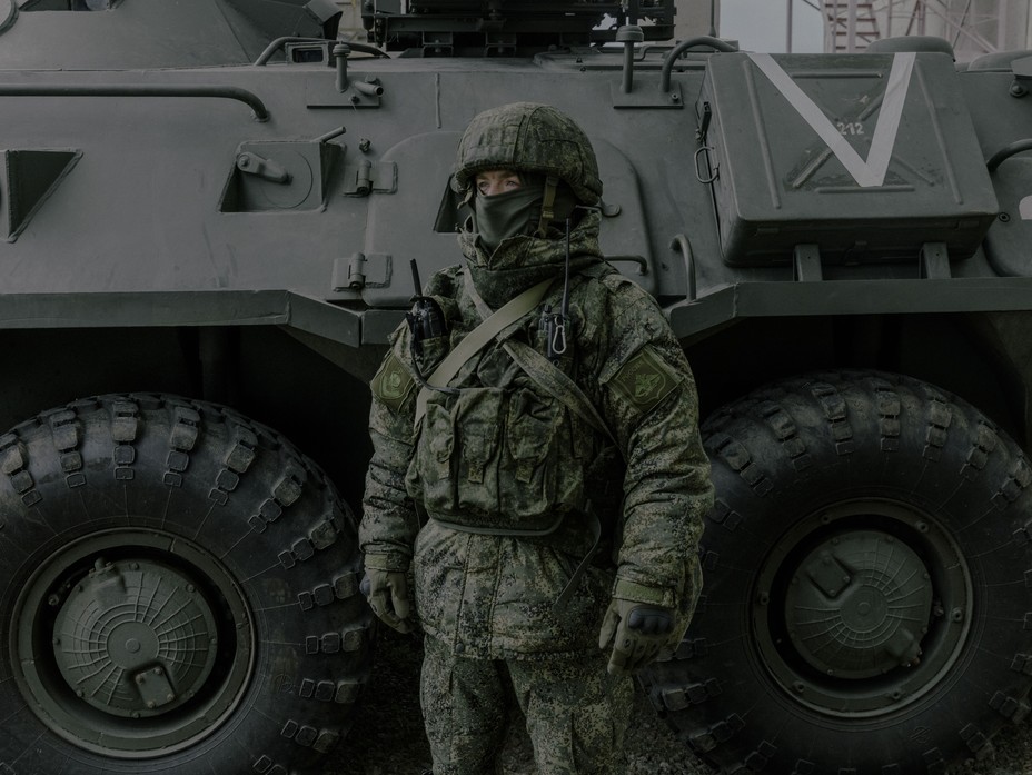 Russian Soldier in front of a tank