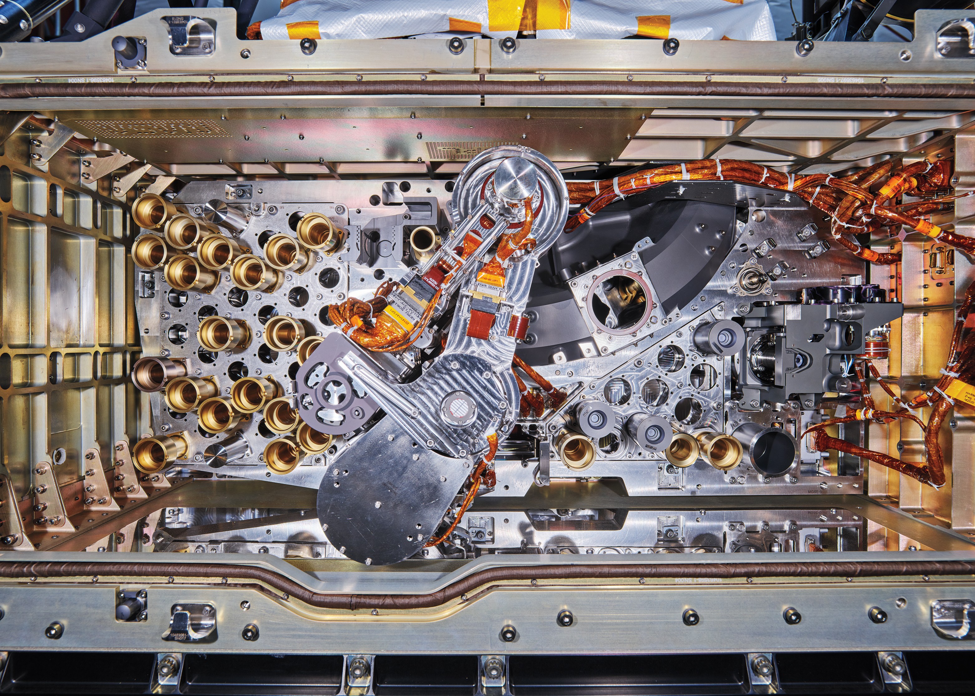 photo of complex inner mechanisms and wiring of a machine designed to collect and store samples