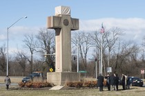 Visitors walk around the 40-foot Maryland Peace Cross in 2019