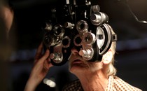 Someone receives an eye exam.