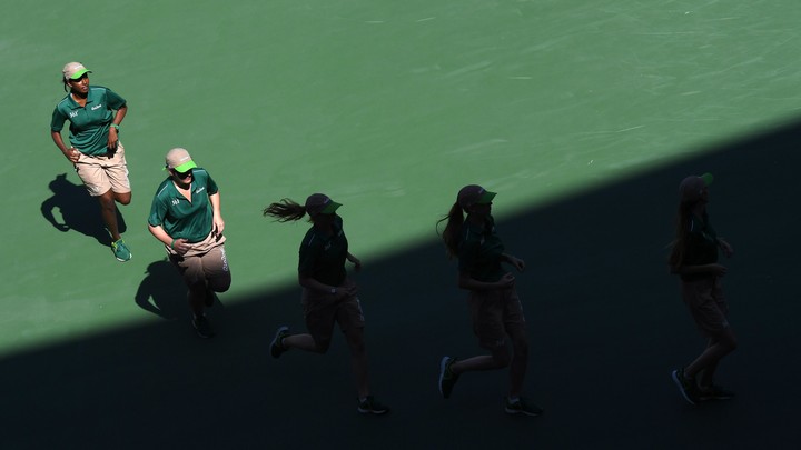 Five female tennis players are running.