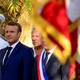 Emmanuel Macron stands at a ceremony alongside two other French officials.