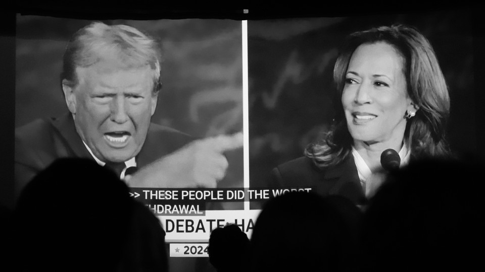 A photo of a split-screen view of Donald Trump debating Kamala Harris