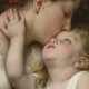 A painting of a mother and her child embracing