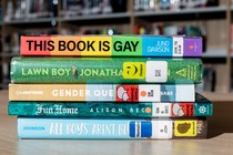 A photo of a stack of LGBTQ-themed books