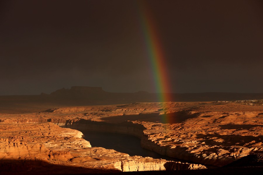 A rainbow above a desert landscape.