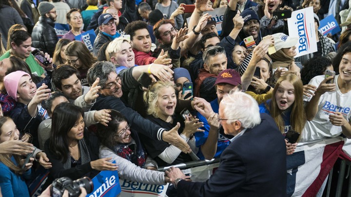 Young voters surrounding Bernie Sanders