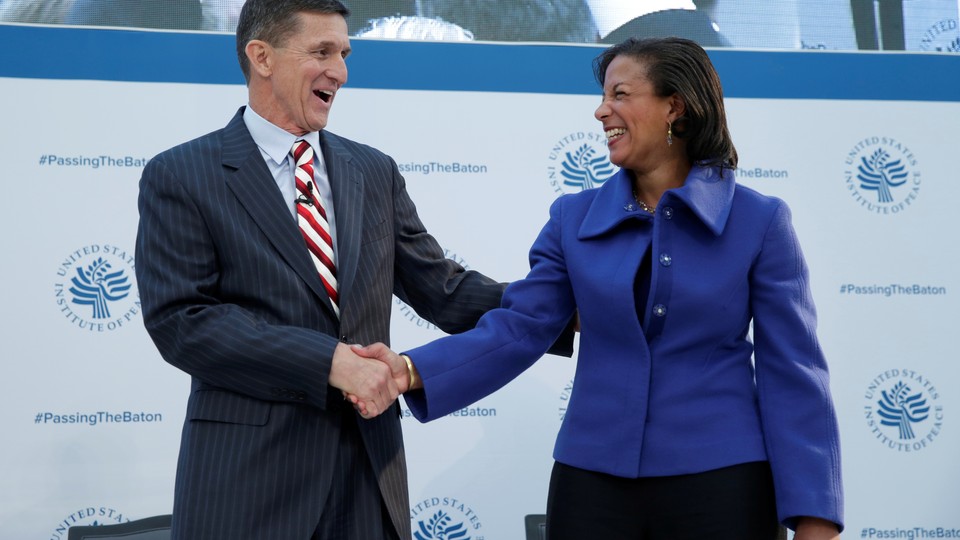 Michael Flynn and Susan Rice shake hands at a January 10 event in Washington.