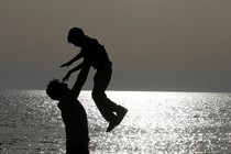 photograph of a family at the beach