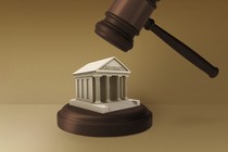 A gavel hovering above a university