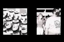 a two-channel video in black-and-white: the one on the left is of a factory line of medical vials, and the other is of people in masks walking