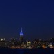 The New York skyline at night, with the Empire State Building lit up for World Autism Awareness Day