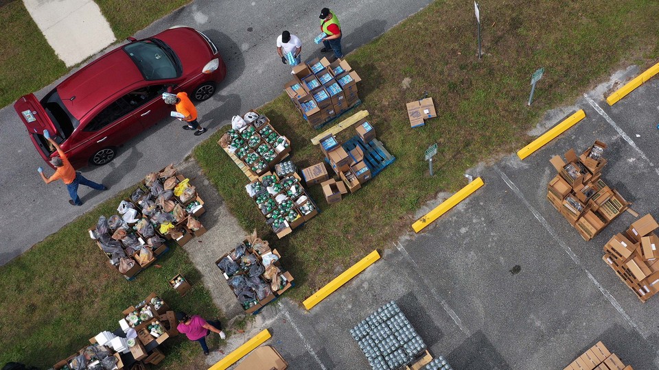 Aerial view of volunteers distributing food.