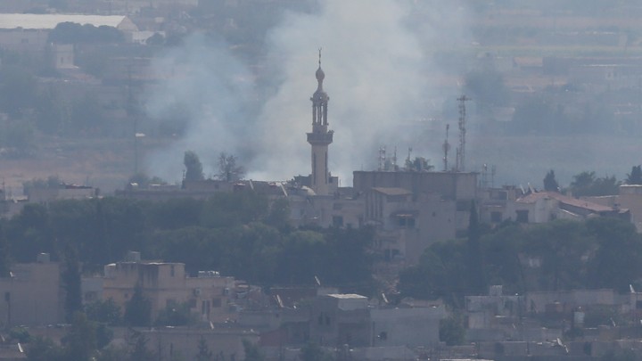 Smoke rises over the Syrian town of Ras al-Ain.