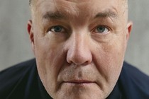 Close-up portrait of Ken Casey