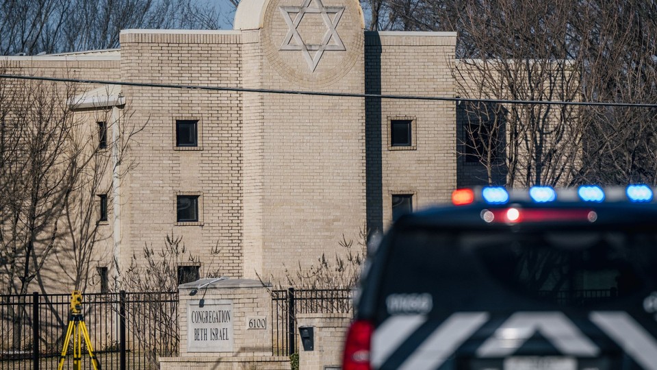 A law enforcement vehicle sits in front of the Congregation Beth Israel synagogue on January 16, 2022 in Colleyville, Texas.