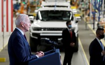 A photo of Joe Biden giving a speech in an auto factory