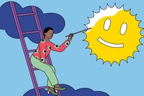 A woman paints a smiley face onto the sun