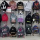 Rows of backpacks hang in a store