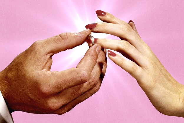 One hand puts a ring on another one