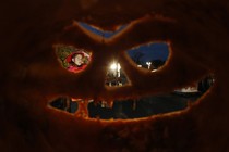 A girl is seen through one of the thousands of carved pumpkins at an Illinois pumpkin festival in 2013.
