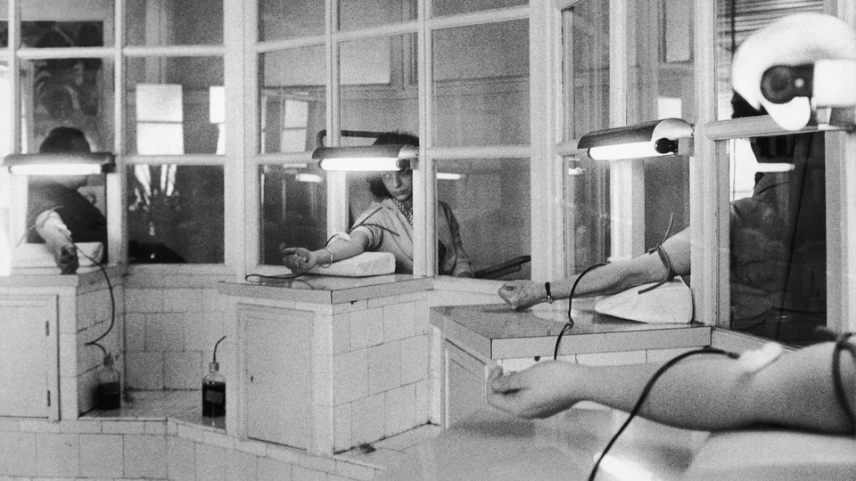 A photo of people getting their blood drawn