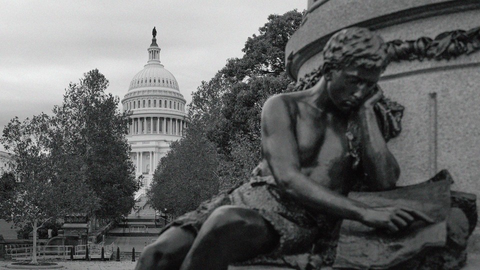 Black-and-white photo of a statue near the U.S. Capitol, whose rotunda is seen between trees in the background.