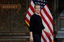 Mark Zuckerberg in front of an American flag at Georgetown University