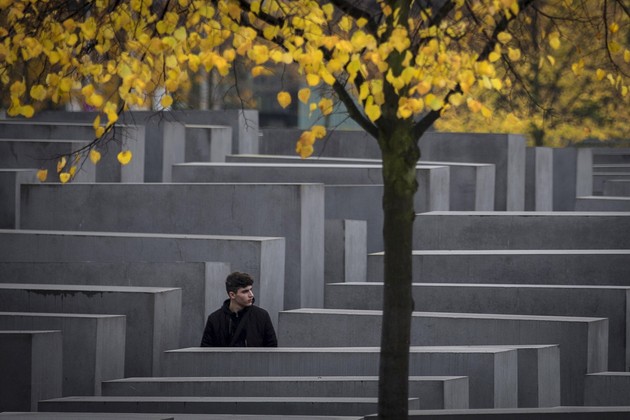 A man walks though the Memorial to the Murdered Jews of Europe in Berlin.