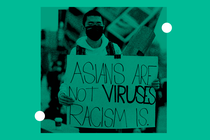 Protester with a sign that reads "Asians are not viruses - racism is"