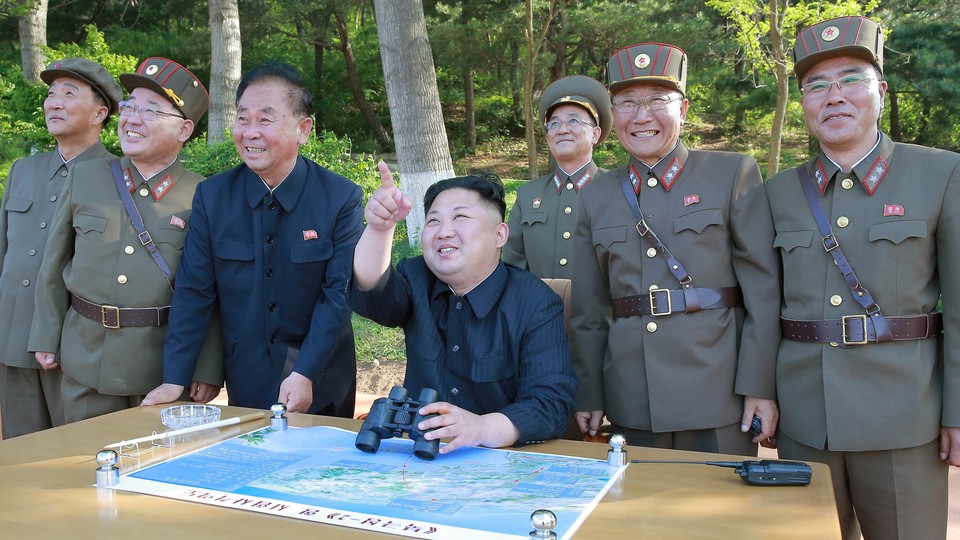 North Korean leader Kim Jong Un observes the intermediate-range ballistic missile Pukguksong-2's launch test in this undated photo released by North Korea's Korean Central News Agency on May 22, 2017.