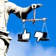 Scales of justice with "Like" and "Dislike" icons