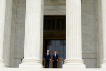 Justice Neil Gorsuch and Chief Justice John Roberts stand on the U.S. Supreme Court building steps in June.