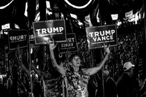 Woman with Trump/Vance signs