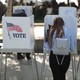 A young woman votes.