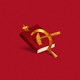 a hammer and sickle piercing a book against a red background