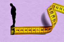 A silhouette of a man standing on the end of a measuring tape, looking over the end