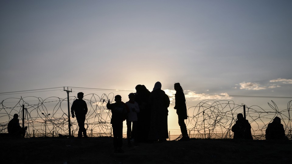 Palestinians who fled Israeli attacks and took refuge in Rafah try to continue their daily lives under difficult conditions in the area near the border wall between Egypt and the Gaza, in Rafah, Gaza, on January 29, 2024.