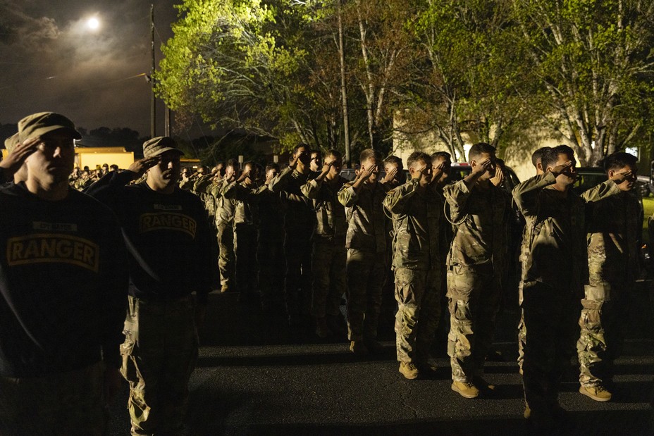Picture of the most elite soldiers salute before dawn before the start of the Best Ranger Competition at Fort Benning in Columbus, Georgia April 11, 2025.