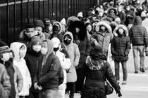 Photo of people in New York City queuing up to receive at-home COVID-testing kits