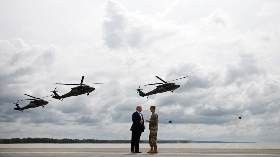 Donald Trump talks with the commanding general of the Army's 10th Mountain Division at a demonstration in New York.