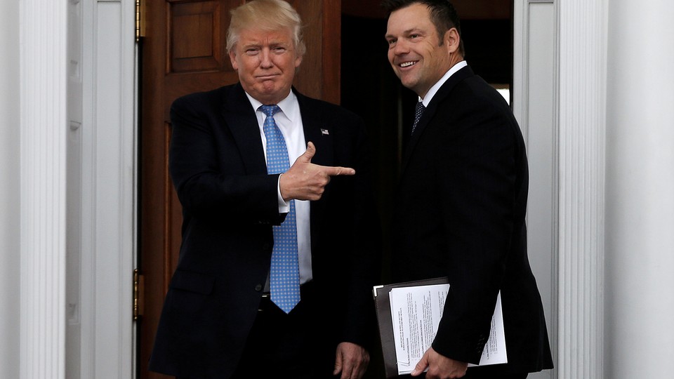 Donald Trump and Kris Kobach meet at Trump National Golf Club in November.