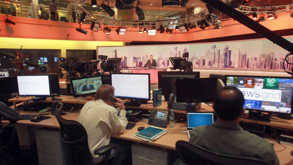 Staff work inside the headquarters of Al Jazeera Media Network in Doha, Qatar, on June 8, 2017.