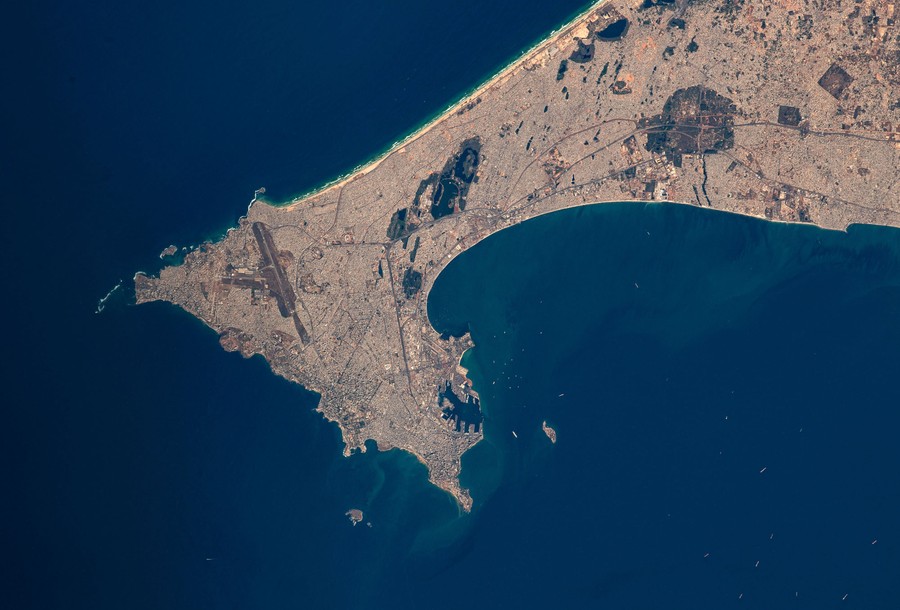 A densely built urban area on a sharp-edged peninsula