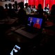 People watch direct broadcast of first U.S. presidential debate between Republican U.S. presidential nominee Donald Trump and Democratic U.S. presidential nominee Hillary Clinton at a cafe in Beijing, China, September 27, 2016.